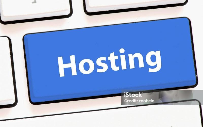 Computer keyboard with hosting Close-up image of a computer keyboard with a glowing blue "Hosting" key, representing web hosting technology and online services.
